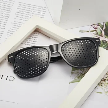 Männer und Frauen verbessern die Sehkraft, Anti-Myopie-Astigmatismus-Brille mit Löchern zur Korrektur
