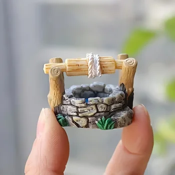 Eine Miniatur-Wunderland-Brunnenstatue - handgefertigte Mikrolandschaftsdekoration aus Kunstharz